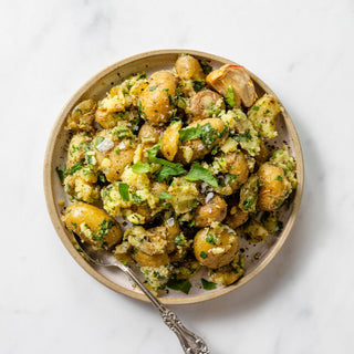 Crushed new potatoes with parsley and olive oil